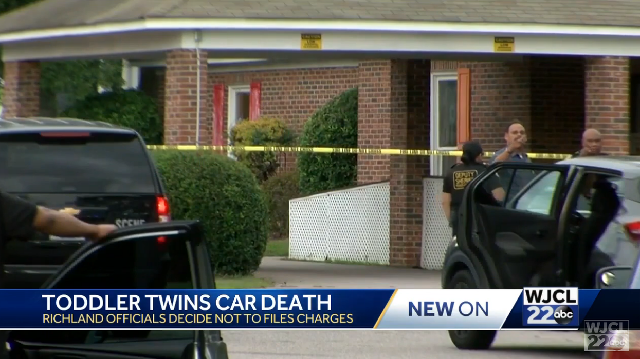 No charges will be filed against SC father in deaths of twin toddlers he left in sweltering car. Sheriff says man was distracted by work.