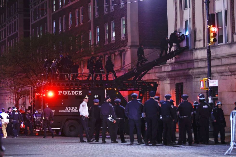 NYPD breach occupied Columbia University building and arrest around 100 Hamas-endorsed students