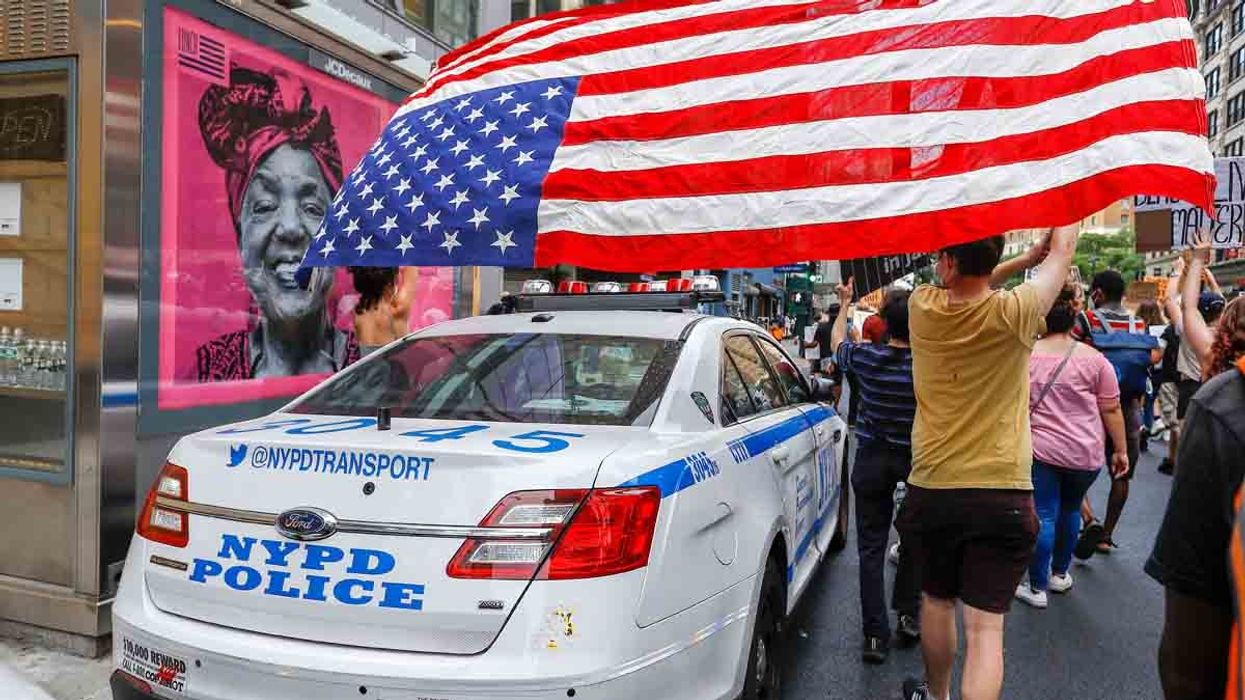NYPD car and protesters