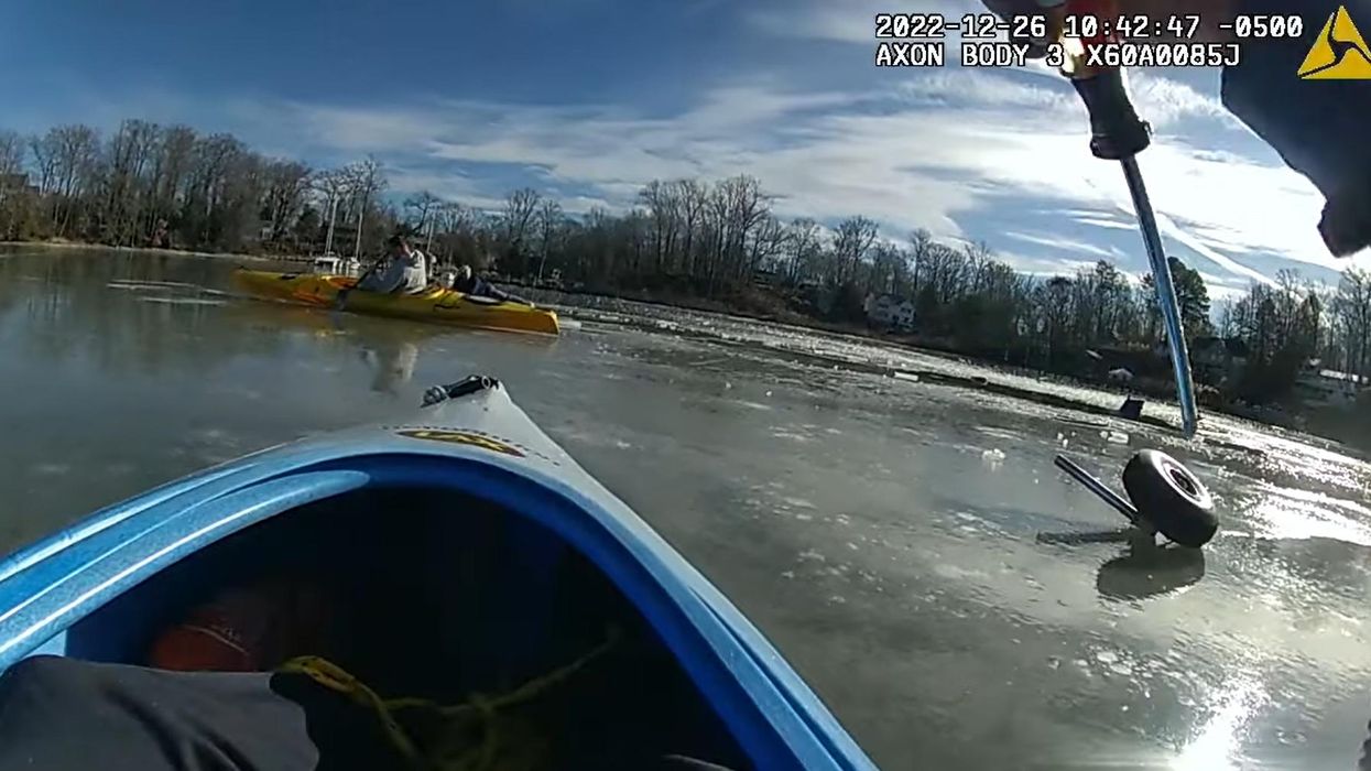 'Oars don't work on ice, but screwdrivers do!' Kayakers scrape along frozen creek to save downed pilot