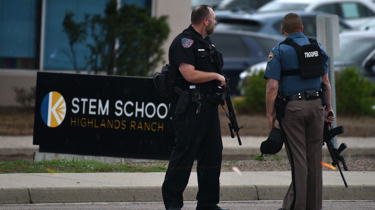 Officers stand watch at the scene of a shooting in which at least seven students were injured at the STEM School Highlands Ranch on May 7, 2019 in Highlands Ranch, Colorado.