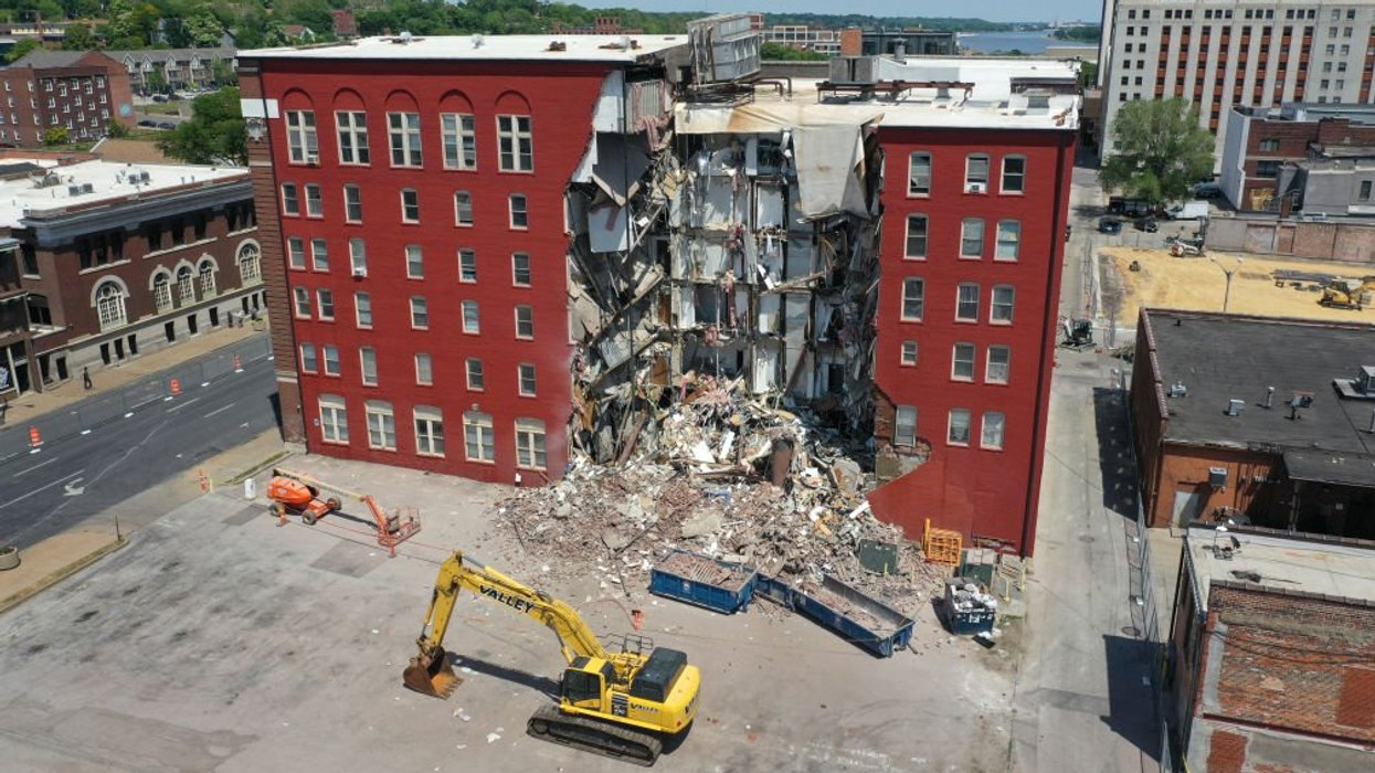 Officials claimed no one left in partially collapsed apartment building ...