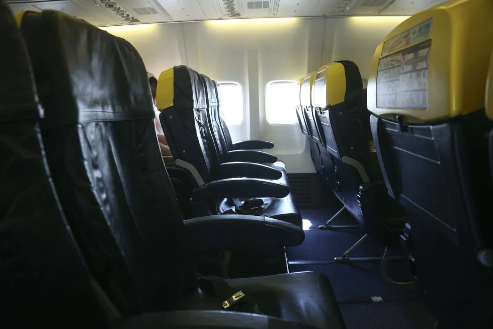 Passenger partially sucked out of window during plane flight — his wife and others held on to him
