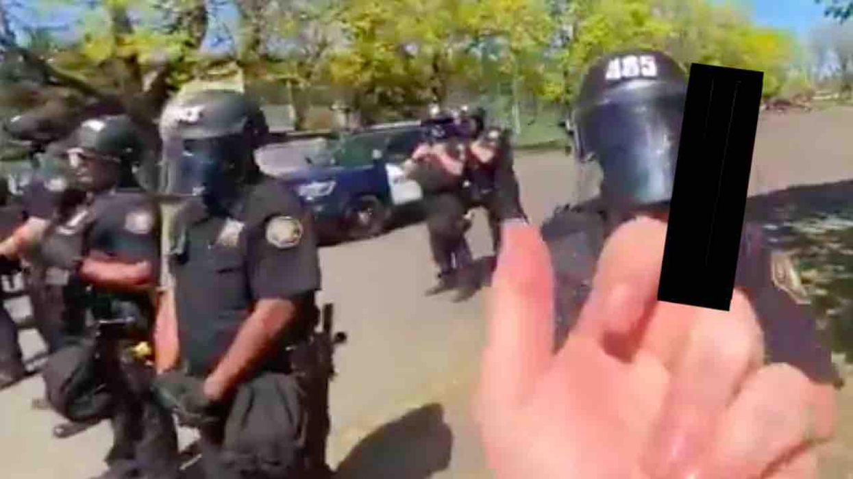 'Pathetic' leftist records himself flipping off row of cops, yelling at them one by one, 'F*** you! Quit your f***in' job!' But Twitter puts him in his place.