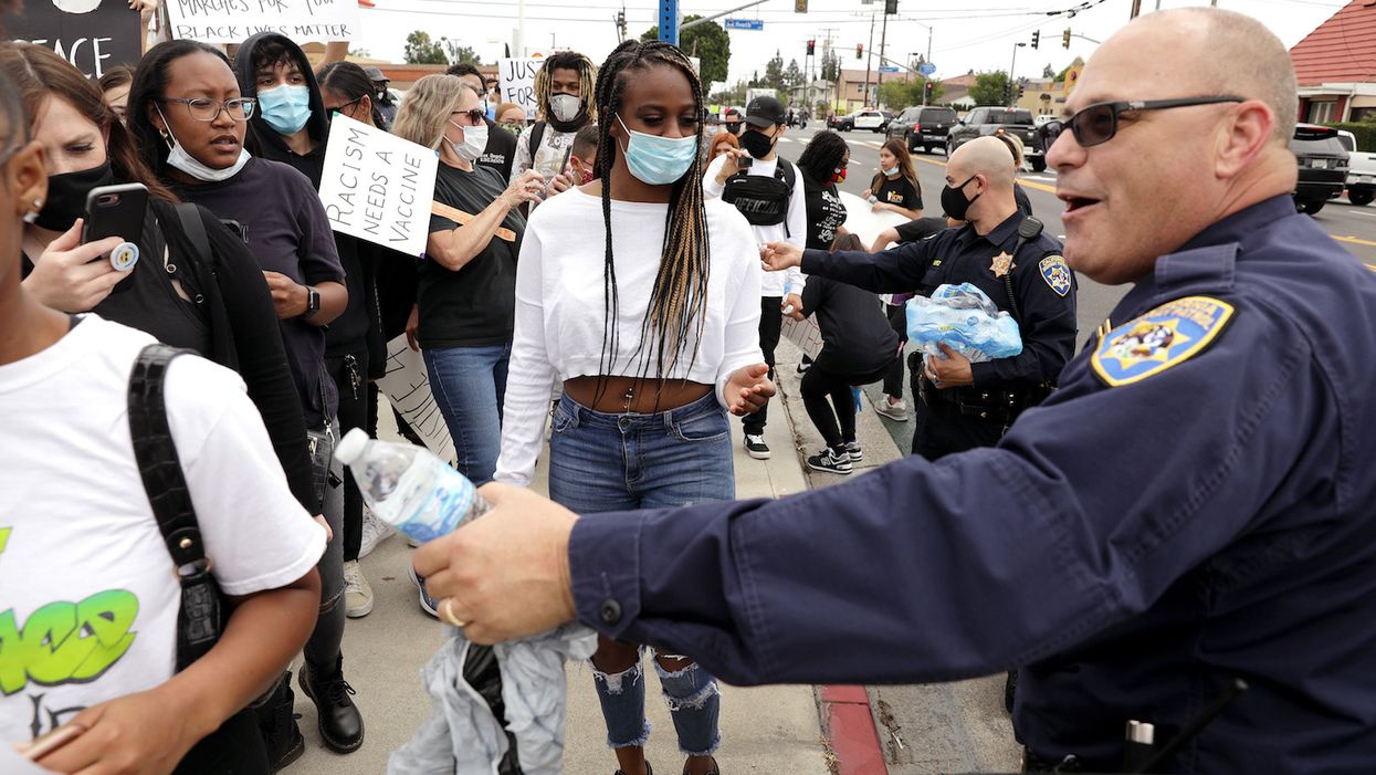 Peaceful protests persist despite the distraction of continued riots and looting