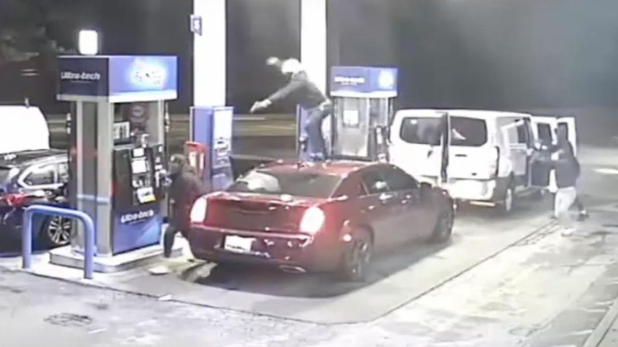 Philly carjacker with flair for dramatic jumps on vehicle's roof, points gun at owner standing by gas pump; 3 other gunmen help chase victim into store