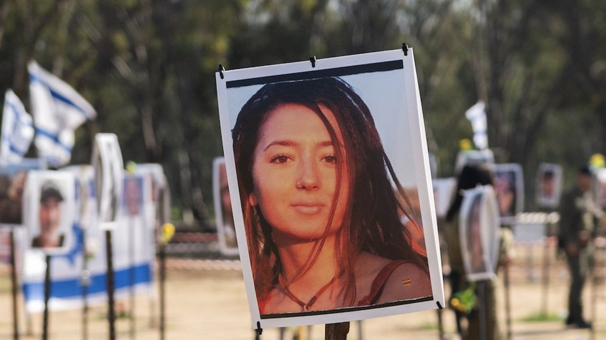 Photo of slain, mostly naked Jewish woman Hamas paraded in truck on Oct. 7 part of prize-winning images — and outrage erupts