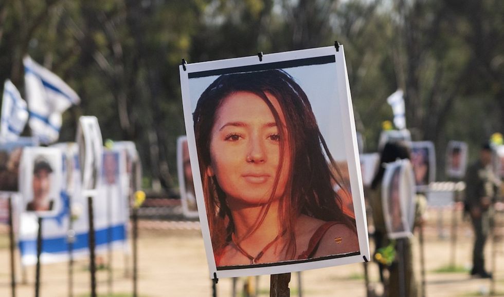 Photo of slain‚ mostly naked Jewish woman Hamas paraded in truck on Oct. 7 part of prize-winning images — and outrage erupts