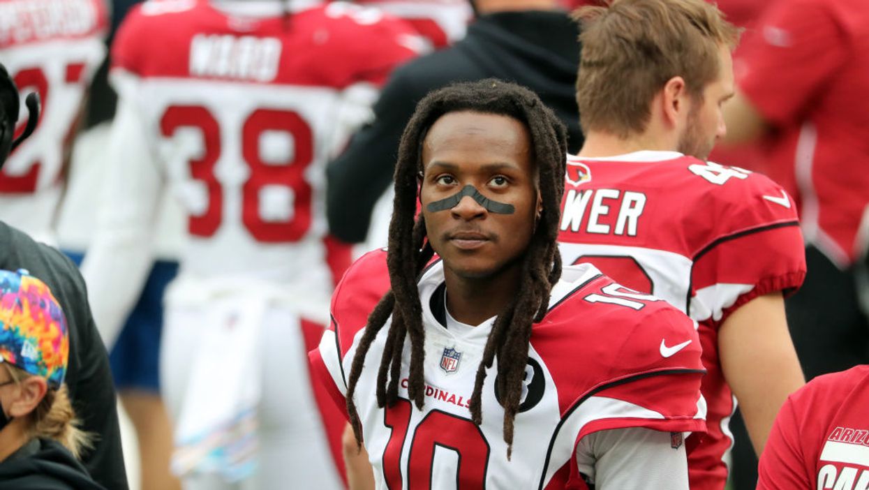 Photos appear to show NFL wide receiver DeAndre Hopkins giving Trump supporters two middle fingers
