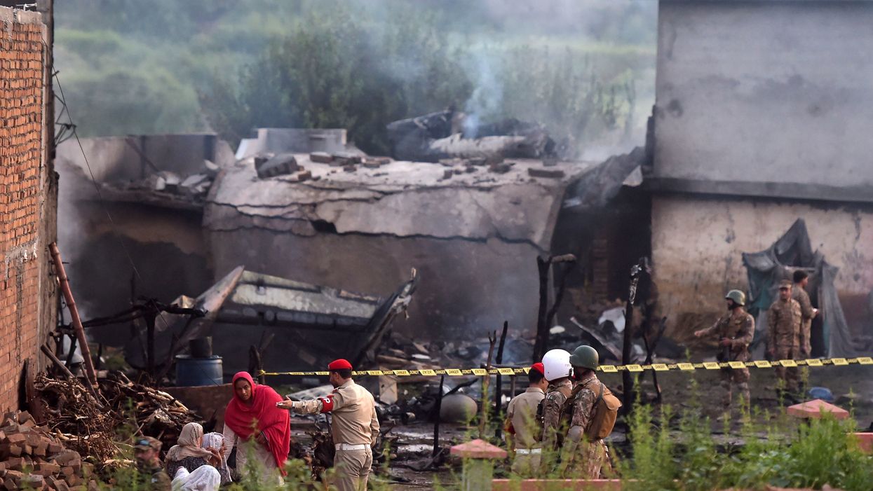 Plane crash in Pakistan leaves town looking like a war zone; all aboard presumed dead