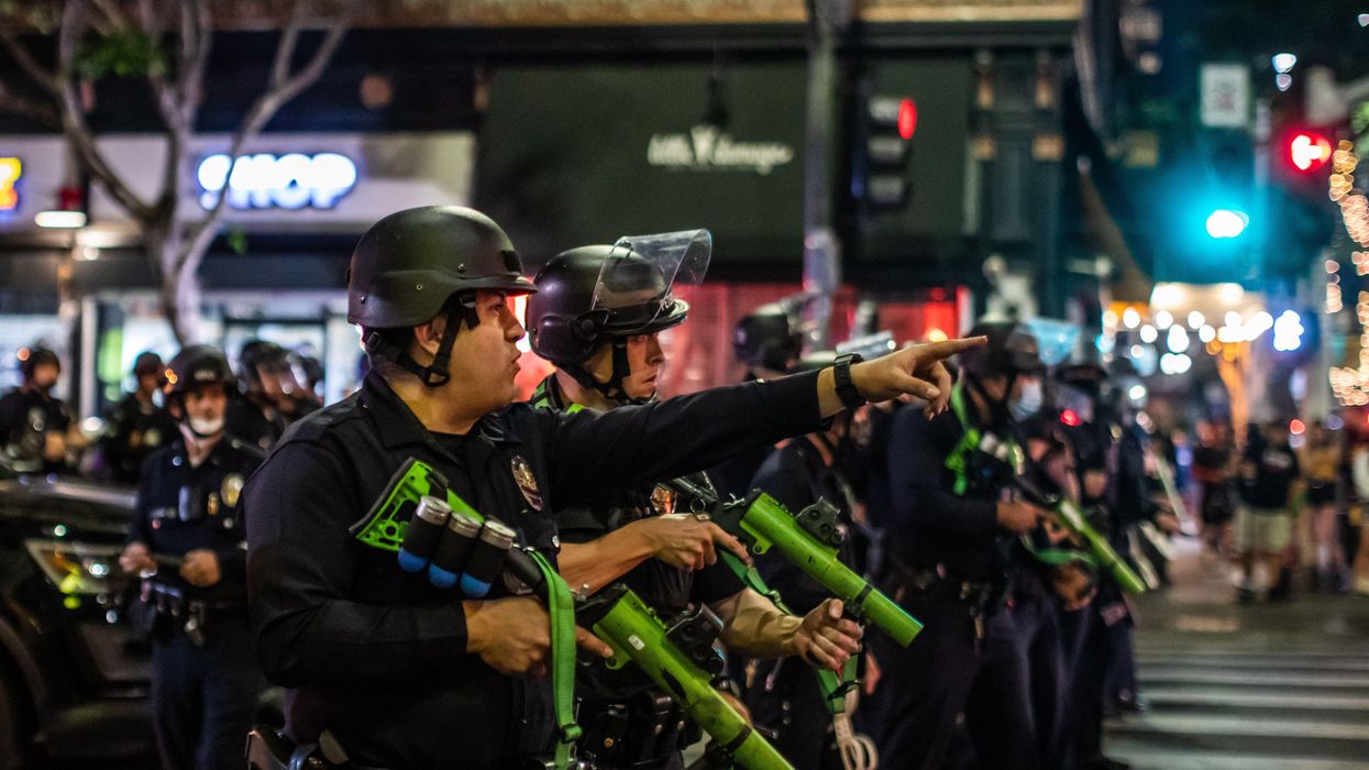 Police fire projectiles on unruly and destructive Rams fans following LA Super Bowl win