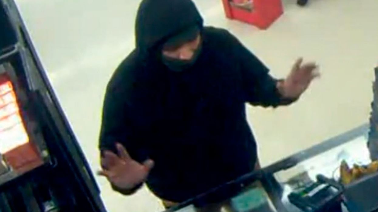 Police released surveillance footag showing a clerk with a gun stopping a hatchet robbery.