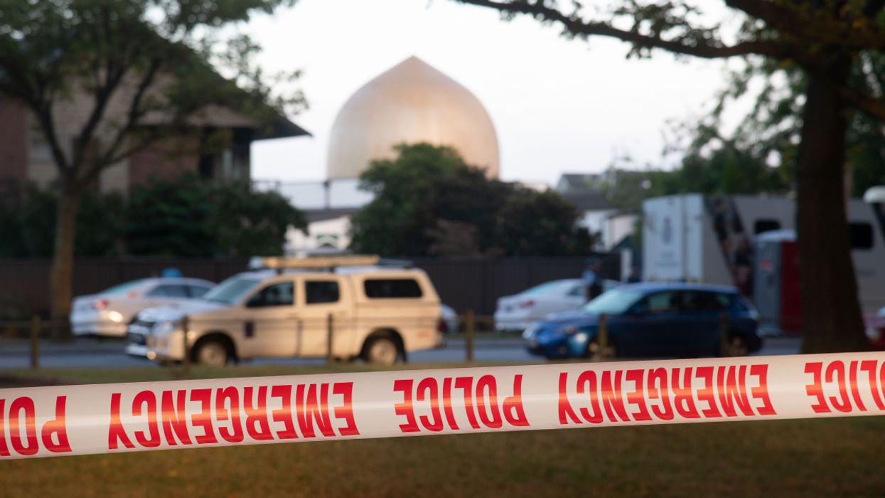 Police secure the area with tape across the road from the Dean Avenue mosque on March 17, 2019 in Christchurch, New Zealand. - A right-wing extremist has been charged in the horrifying gun attacks on two New Zealand mosques, which left 49 people dead and dozens more injured.