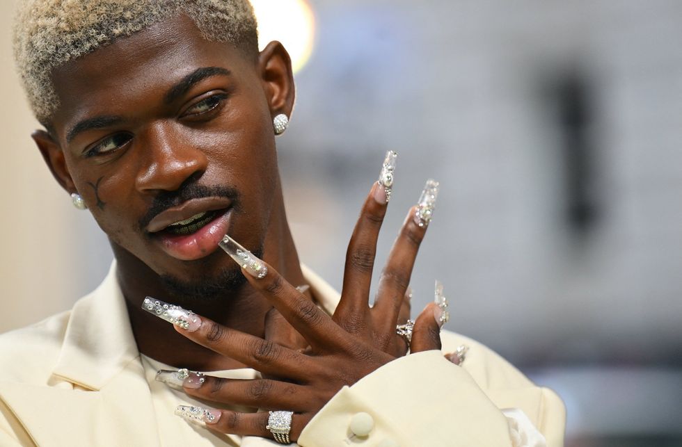 Popular rapper captured on video prancing through Los Angeles streets in his underwear before arrest and hospitalization