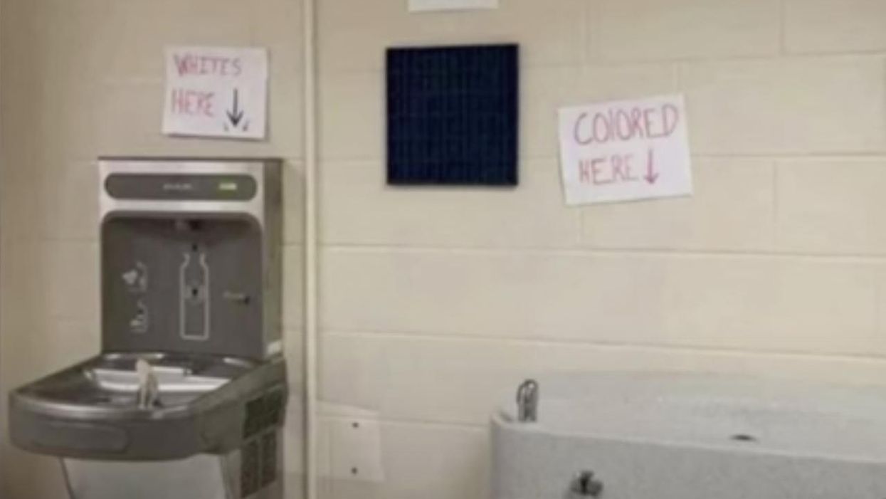Racist signs found above water fountains in Georgia high school. Turns out student of color is behind hate hoax.