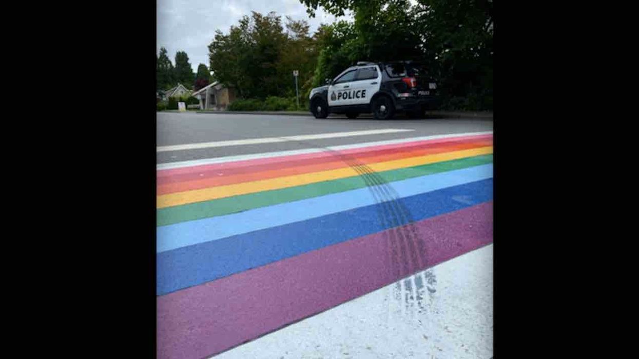 Rainbow crosswalk with tire mark