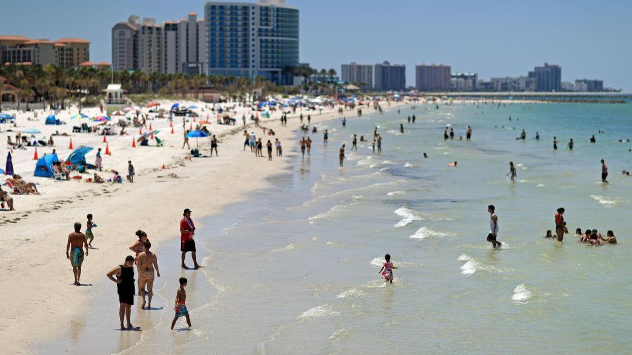 Record number of tourists flocked to Florida in 2021. Gov. DeSantis says 'free state' policies enticed travelers looking to 'escape lockdowns.'