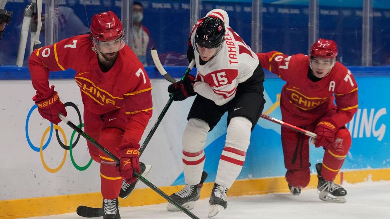 Report: China's Olympic hockey team has 17 players from US and Canada. When asked about citizenship, one US-born player said, 'I don't think we're supposed to comment on that.'