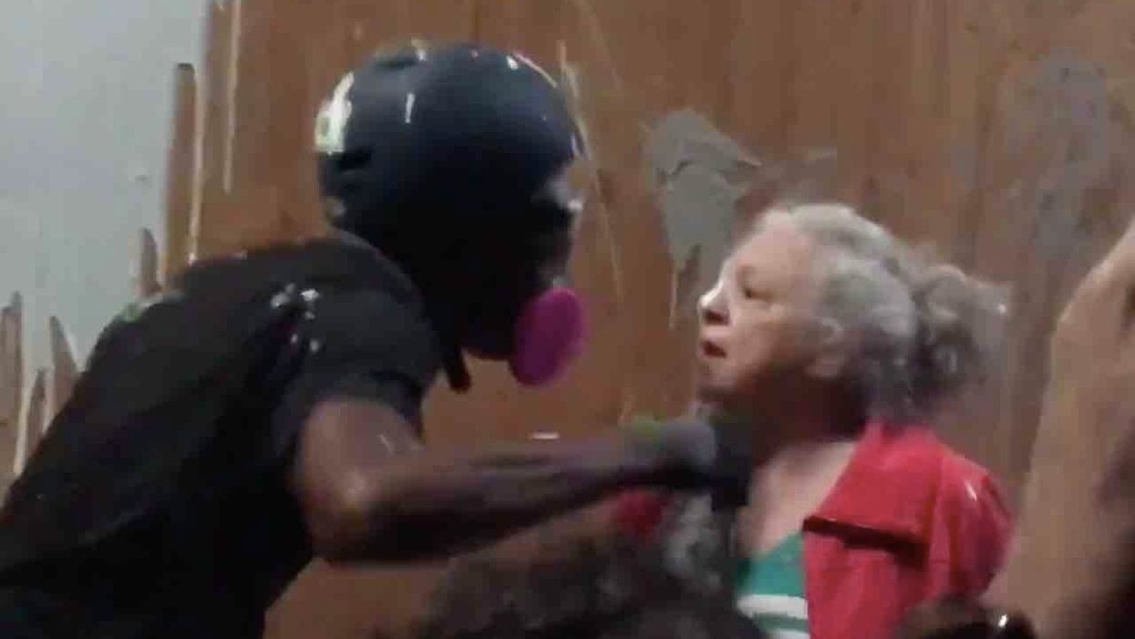 Rioters splash paint on elderly woman, get in her face when she stands up to police precinct attack