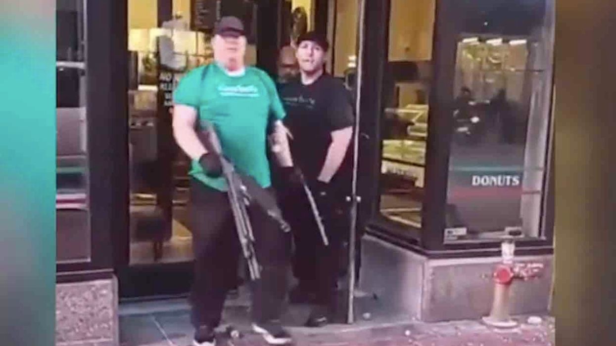 Rioters try forcing way into bakery, but owner and sons meet them at door with guns