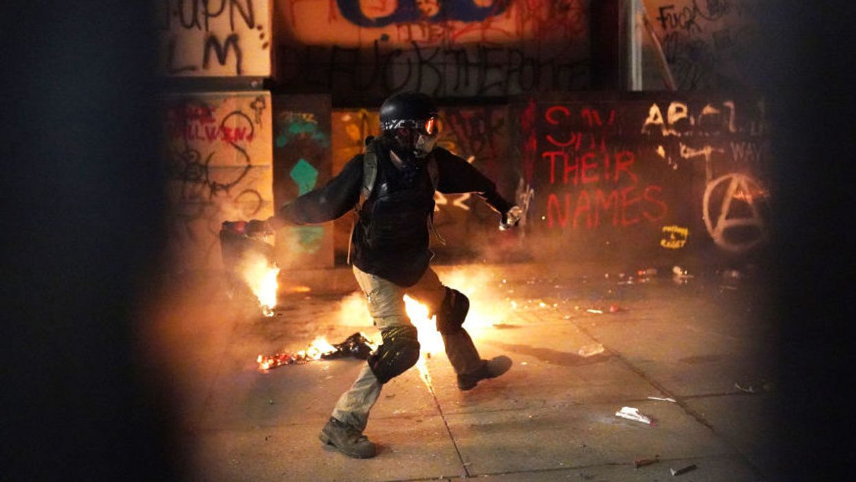 Riotor attacking building