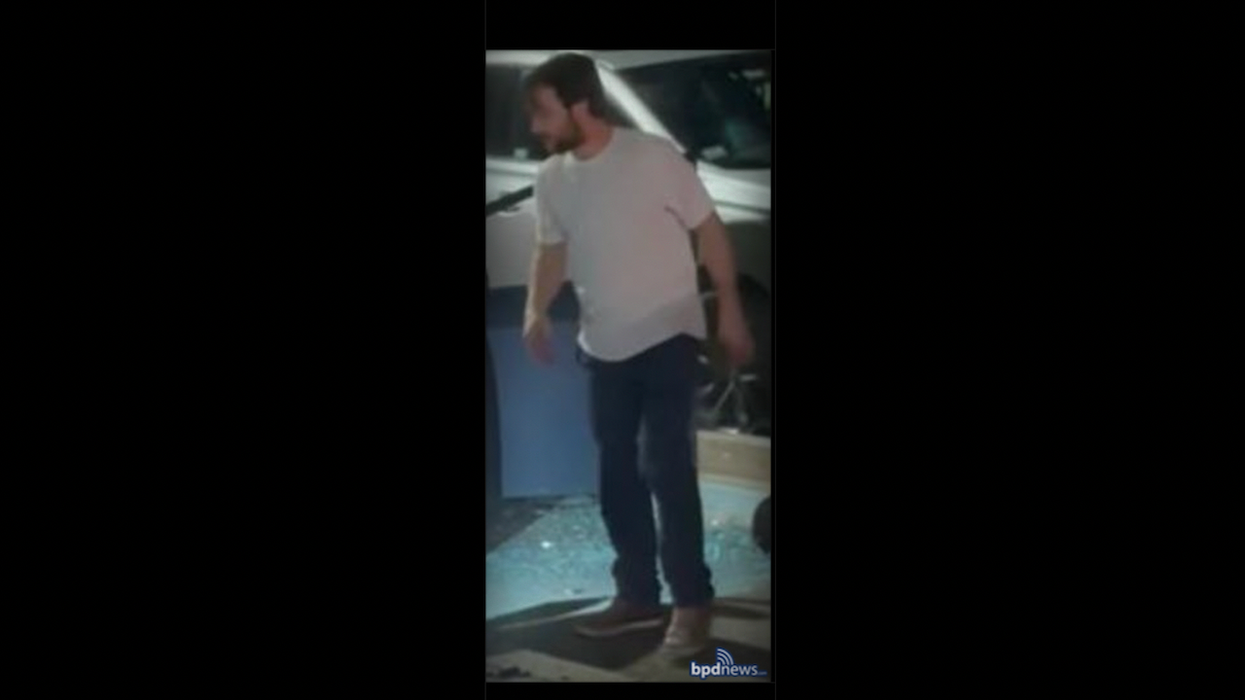 Road-rage suspect uses hatchet to repeatedly smash windows of crashed car — and the act is caught on cellphone video