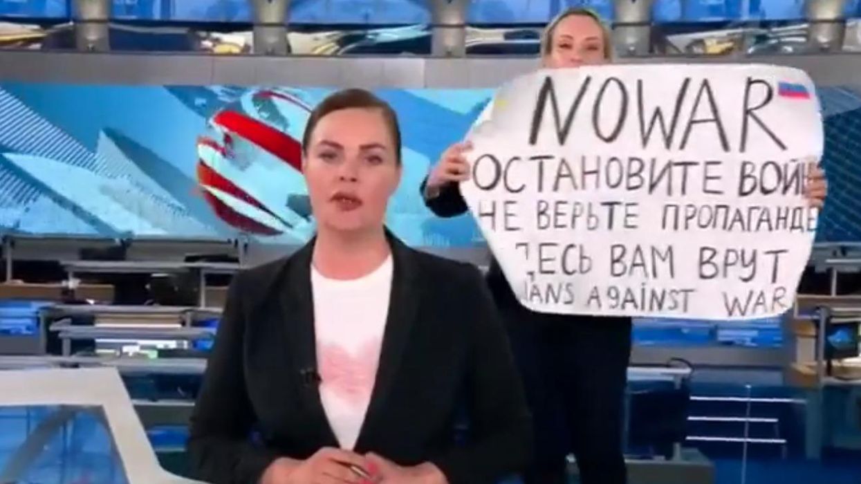 Russian journalist interrupts live broadcast with brave anti-war protest: 'They can't lock us all away'