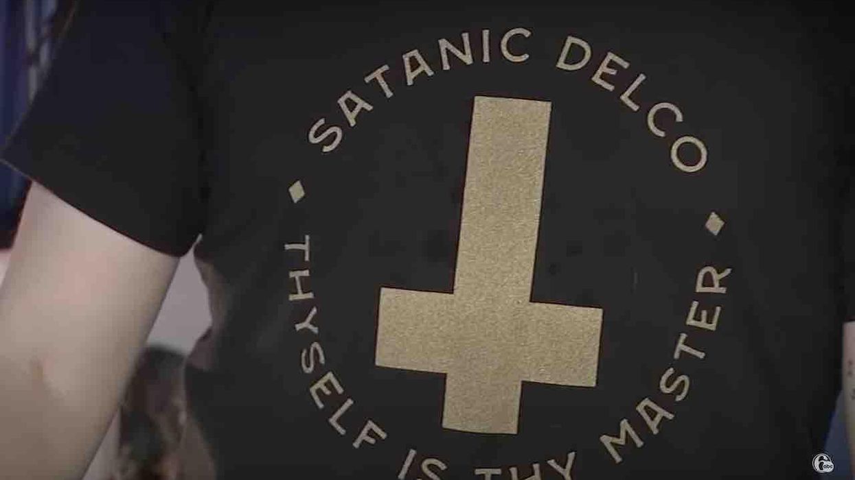 Satanic group gets school district to drop rule banning clothes with satanic, cultic references. Satanic group's leader exults that school officials 'caved.'