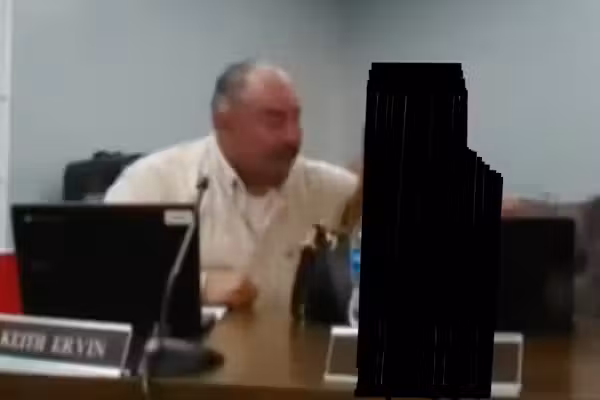 School board member tells HS girl, 'God, you're hot,' appears to touch her during meeting — now he's charged with assault