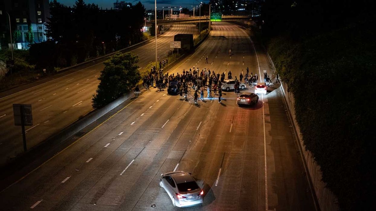 Seattle freeway with protesters stopping motorists