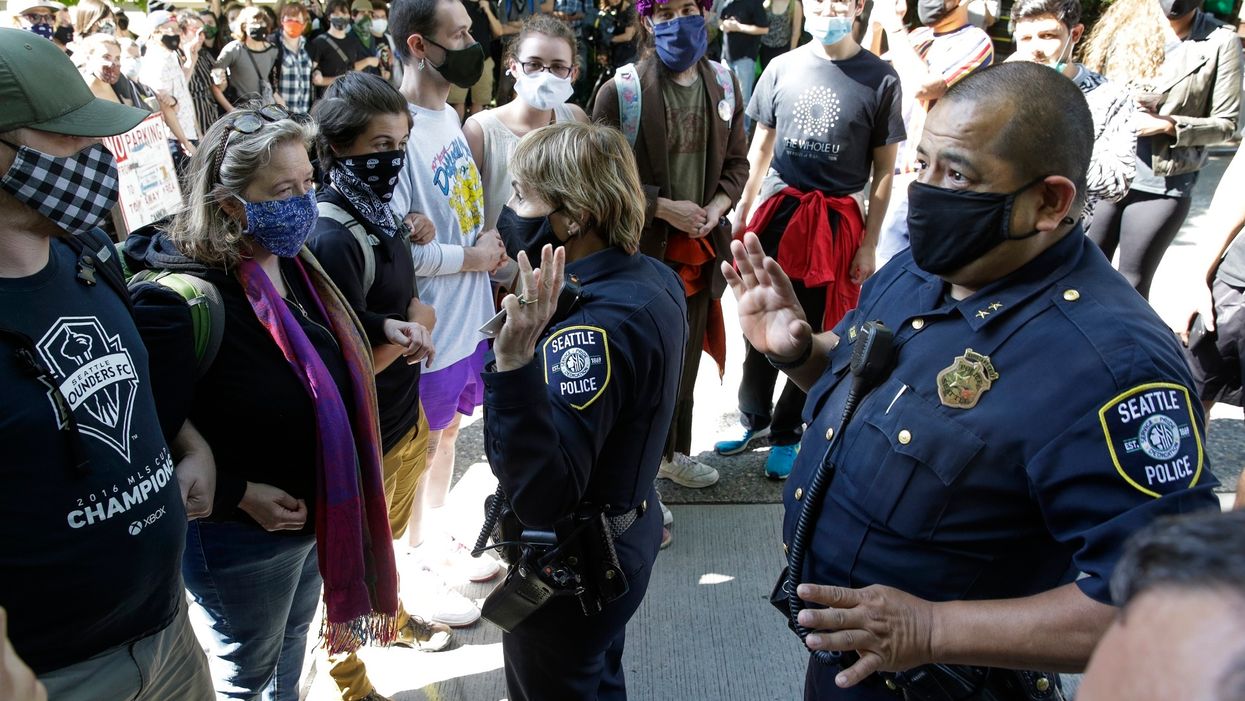 Seattle mayor praises 'cop-free zone' as police battle protesters to help neighborhood residents