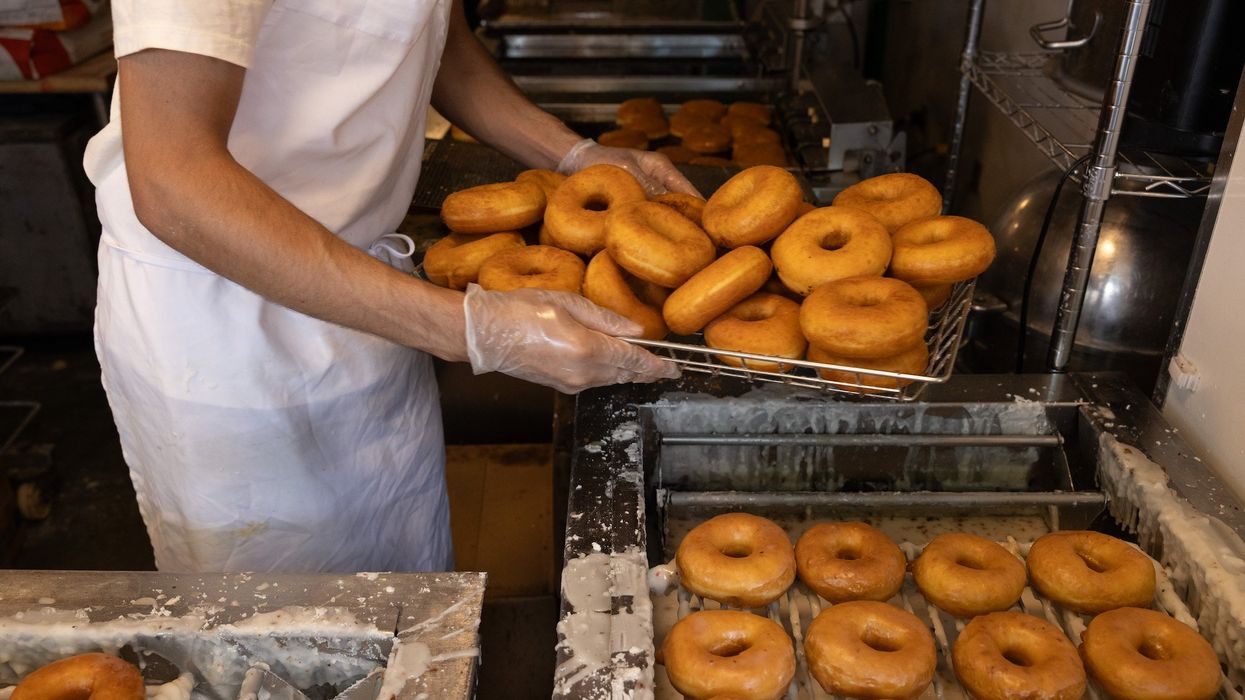 Security video shows workers fighting off man in bikini trying to rob donut shop