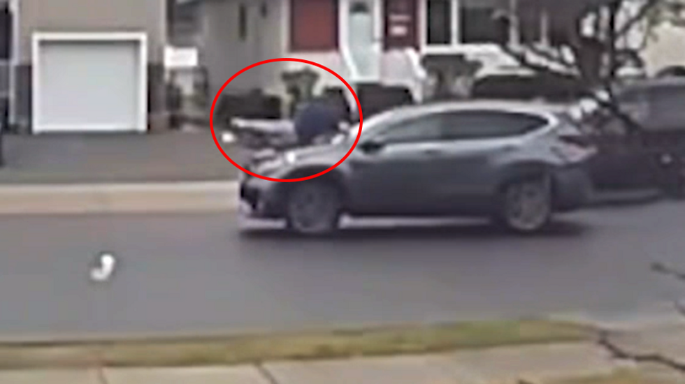 Shoeless man jumps on hood of moving car after thief steals his Rolex