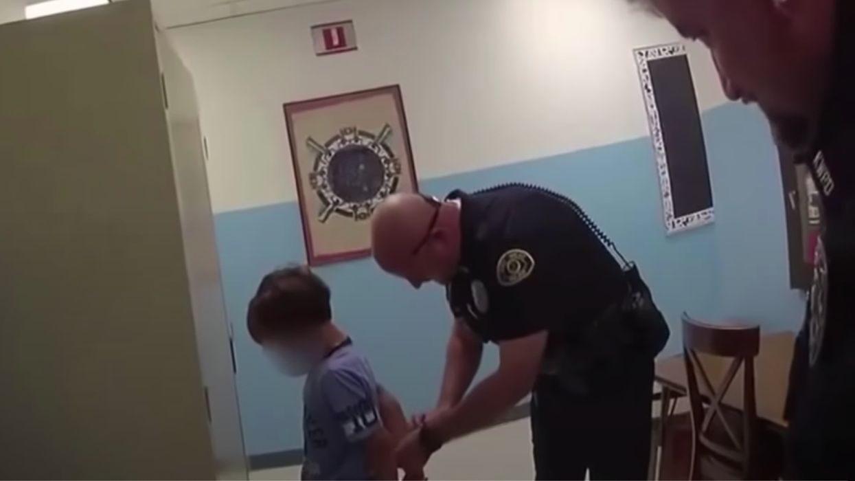 Small boy being handcuffed