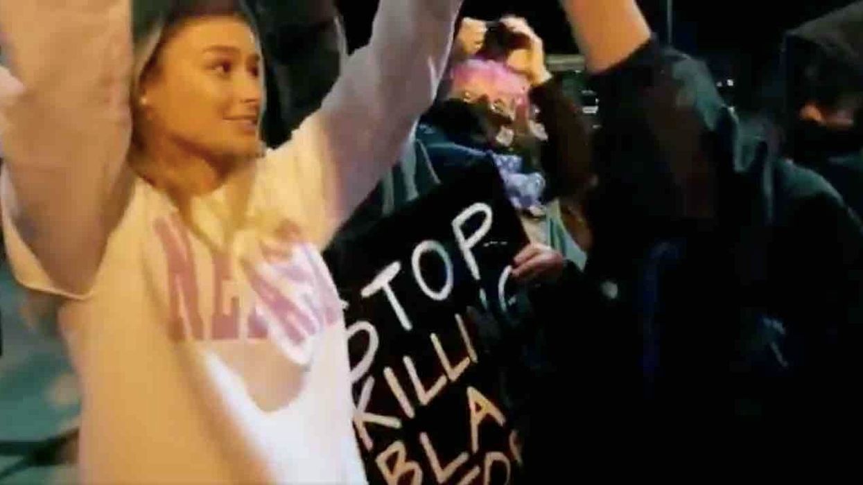 Smiling woman holding pro-police sign infuriates Black Lives Matter protester who threatens, bullies her: 'Baby girl, you're not walking away anywhere!'