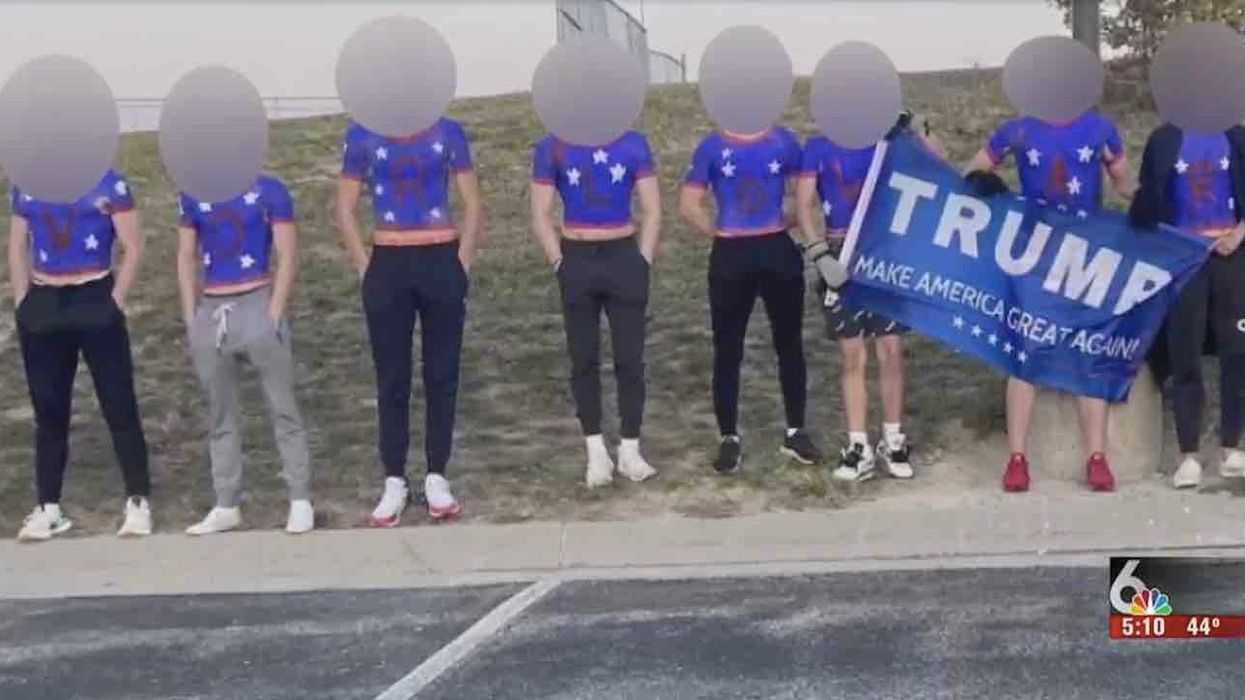 'Soaked in white supremacy': Parent freaks out over image of students painted red, white, and blue and holding Trump MAGA flag