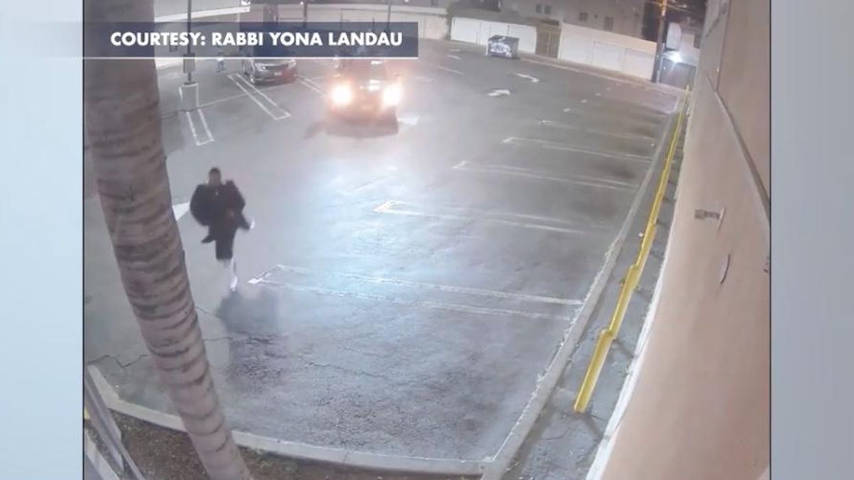 Surveillance video shows Jewish man being chased down by cars waving Palestinian flags. He says ran for his life as they began shouting 'Allah akbar!'