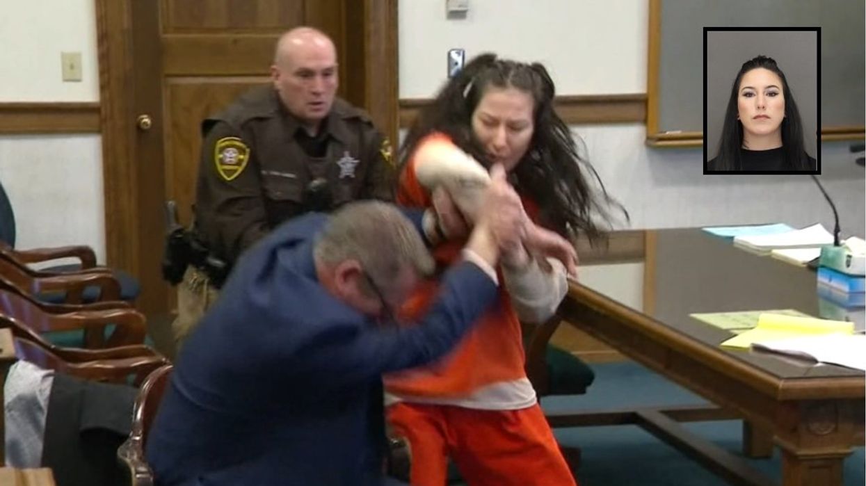 Defendant on trial for gruesome murder attacks her attorney during court appearance