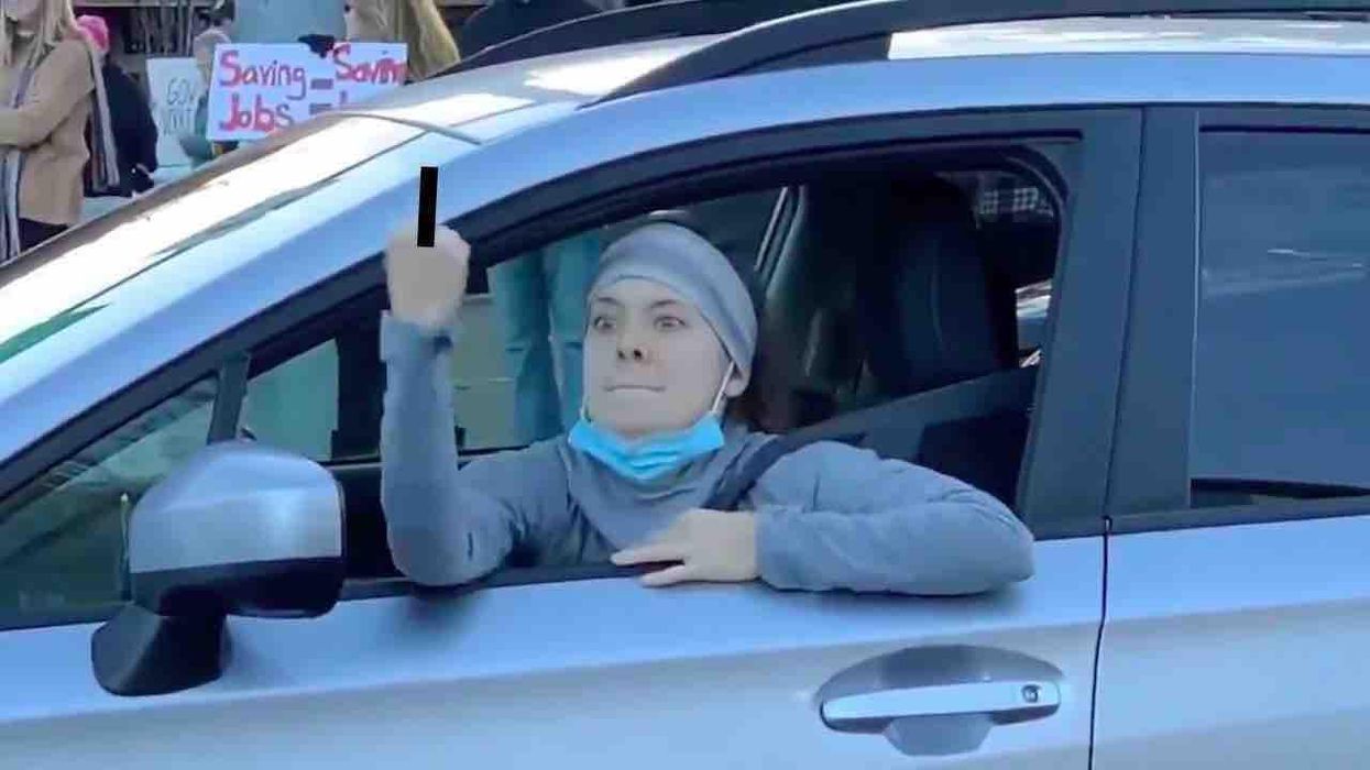 Teacher who flipped out on anti-lockdown protesters is under investigation, placed on leave