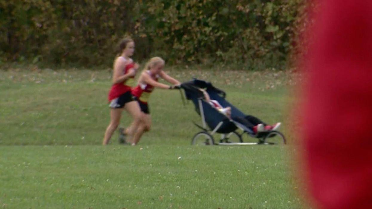 Teen runner makes headlines as she pushes wheelchair-bound older brother during race in order to compete together