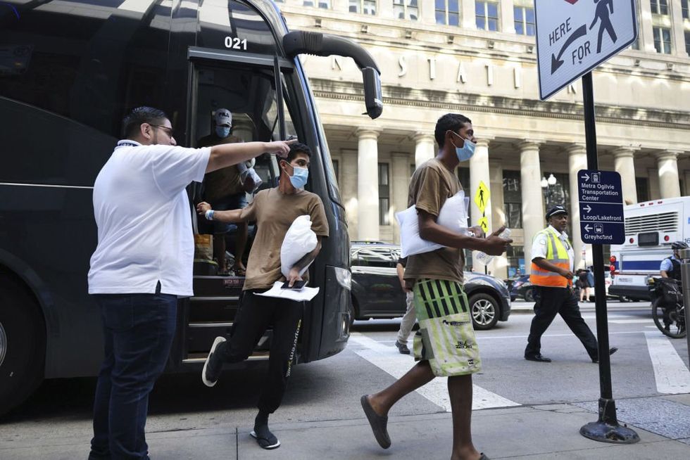 Texas bus company sues Chicago over migrant drop-off rules‚ accuses 'sanctuary' city of 'turning its back' on asylum-seekers