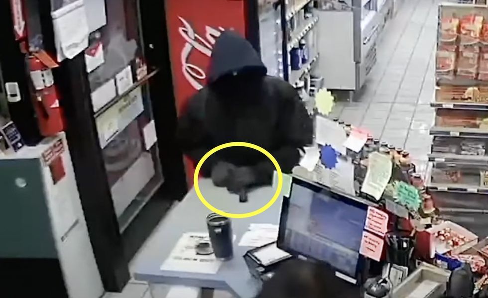 'Then shoot me': Gutsy woman stands up to gun-toting thug who threatened to open fire if she didn't hand over store's cash