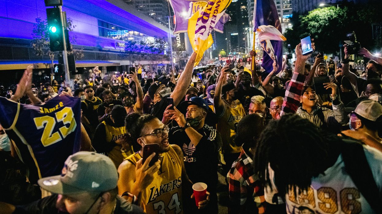 Thousands of fans ignore COVID rules to converge at LA Staples Center following Lakers' championship win; many target cops during chaos