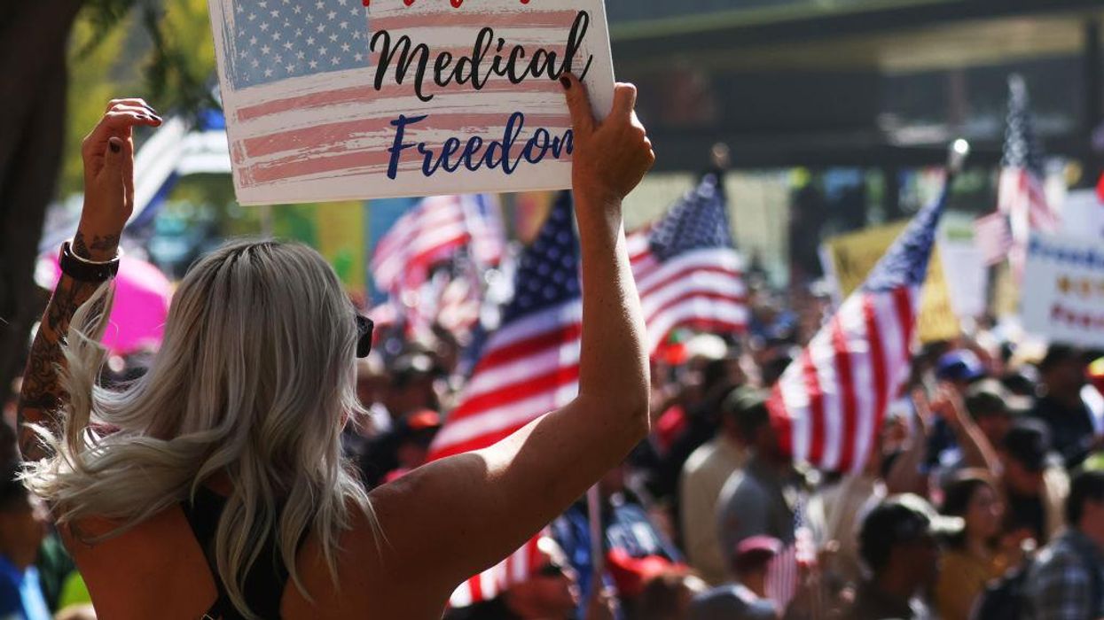 Thousands take to the streets of downtown Los Angeles to protest city vaccine mandate