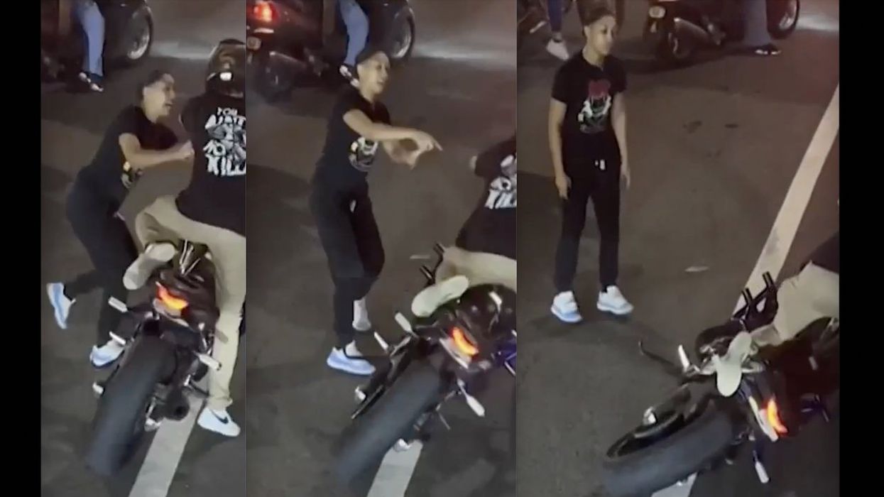 Thug biker stomps, smashes rear window of car with kids, 2 and 5, in back seat. Mom confronts biker, who points gun at her — but she won't back down.
