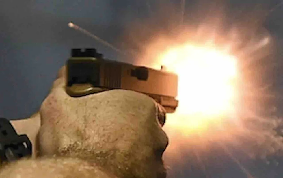 Thug forces his way into apartment, attacks elderly resident. But armed neighbor rushes over and permanently ends threat.