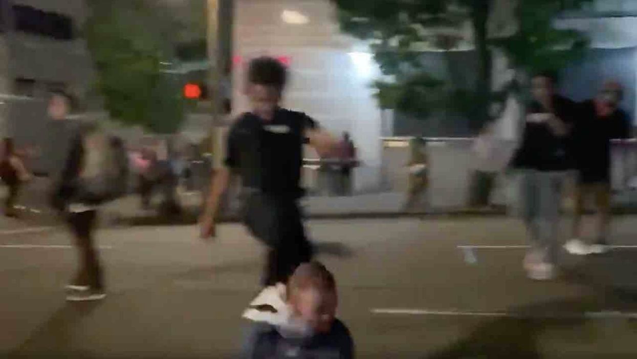 Thug in 'security' vest kicks man in head after Portland militants beat him, force him to sit in street