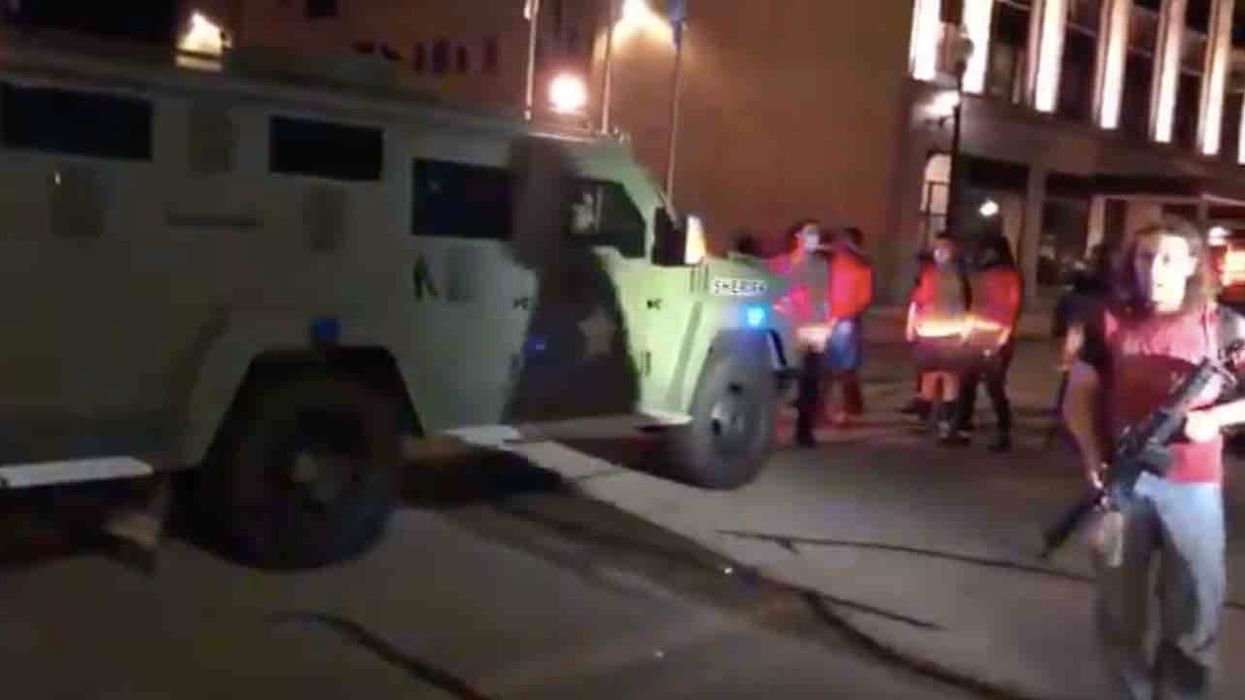 Thugs with rifles, handguns stare down sheriff's vehicle during Kenosha rioting