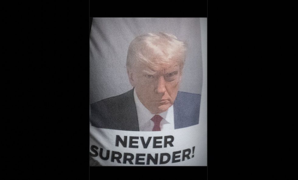 Trump fans unfurl 'Never Surrender' banner with his mug shot during national anthem at Yankee Stadium