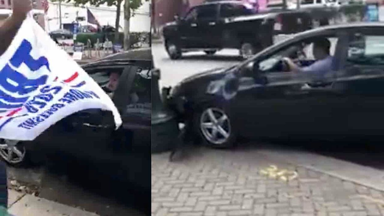 Trump-hating motorist spits on MAGA guy's banner, appears to curse him out as he speeds off — and then pays for it, bigly